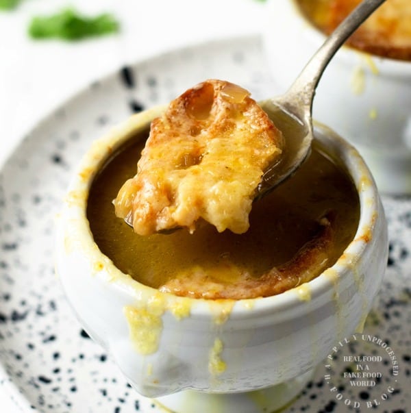 FRENCH ONION SOUP A bistro classic. Caramelized onions, deep rich beef broth, fresh baguette and melted gooey cheese #frenchonionsoup #vegetarianrecipes #cleaneating #healthy #soup #fallrecipes #happilyunprocessed #souprecipes