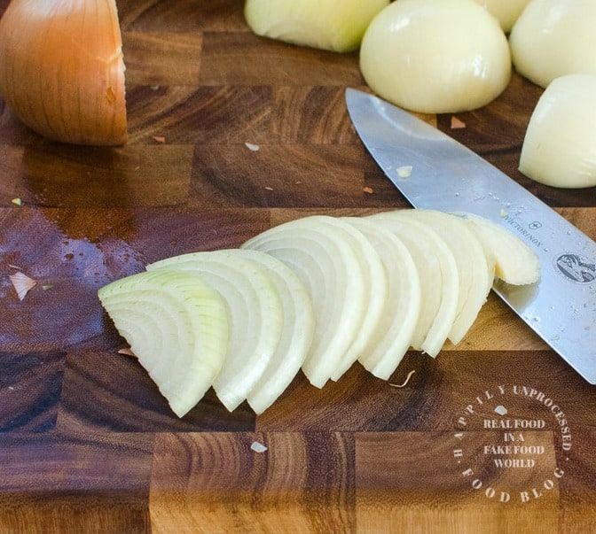 onions that have been peeled and sliced into thin strips