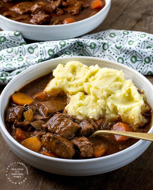Traditional Irish Beef Stew with chunks of beef, carrots, onions, celery simmered in brown gravy #beef #stew #winterfood #healthy #happilyunprocessed