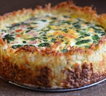 Spinach gruyere cheese quiche with hashbrown crust