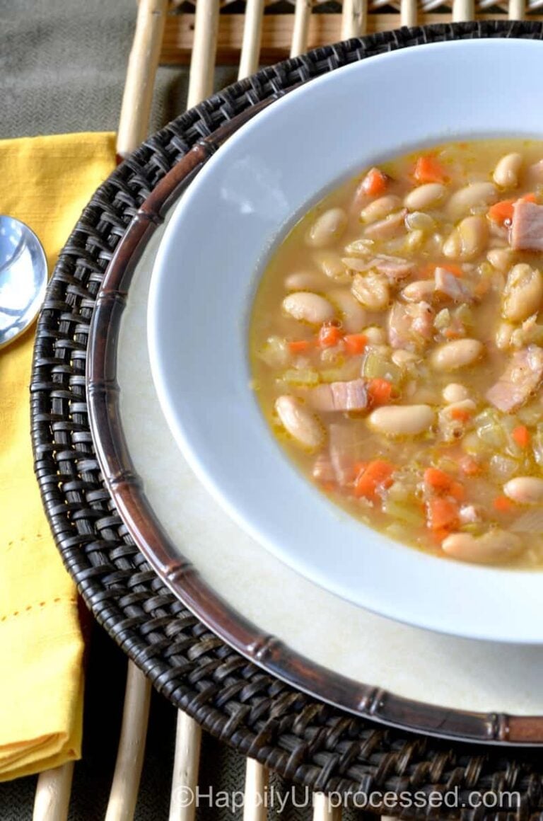 white bowl of white cannellini beans and ham soup