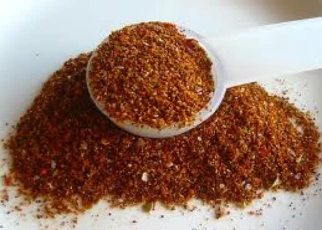 Spoon filled with taco seasoning