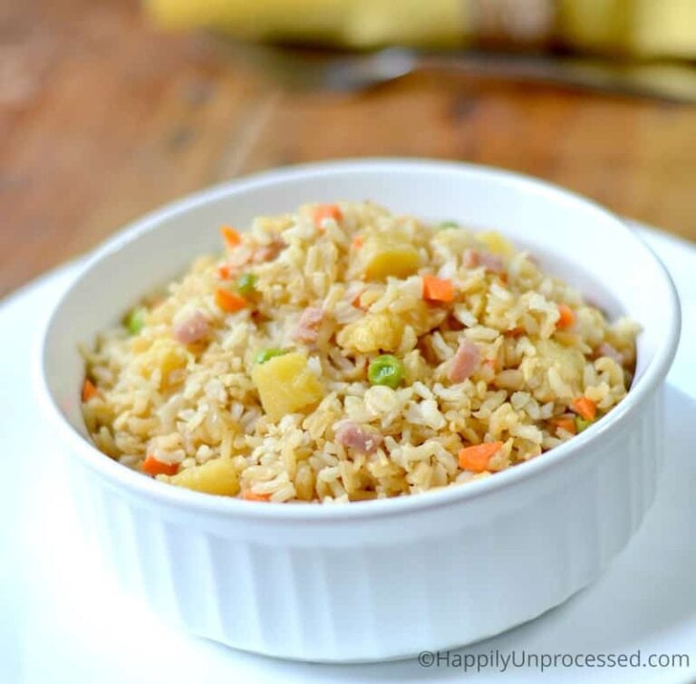 Pineapple Fried Rice with ham, peas, diced carrots in white bowl