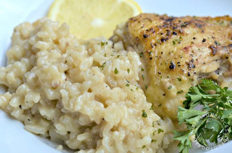 White plate with chicken thigh lemon pepper garlic risotto one skillet