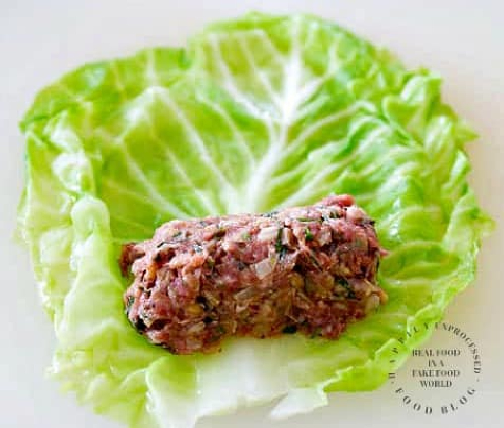 How to roll up cabbage leaves for stuffed cabbage recipe filled with beef, pork and rice