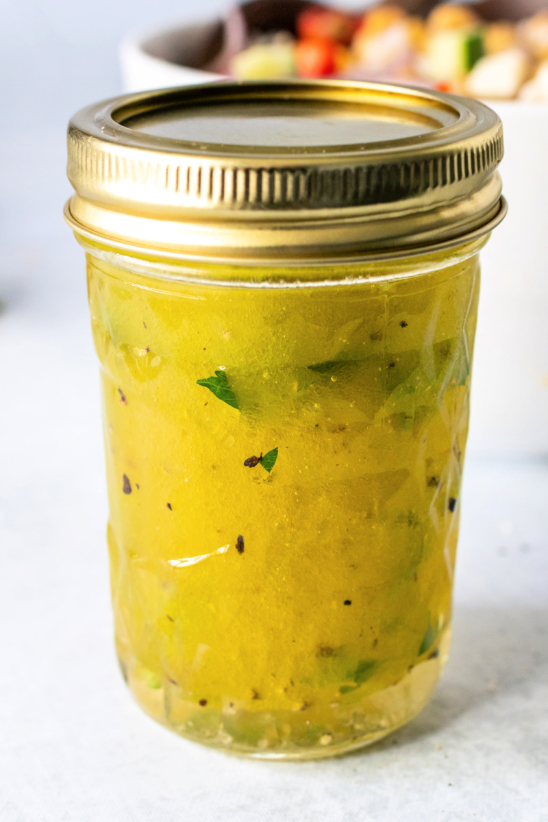 Mediterranean Chickpea and Feta Salad homemade dressing in a mason jar