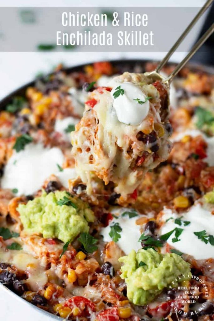 shredded chicken, black beans, corn, tomatoes with rice in enchilada sauce topped with melted cheese in one skillet