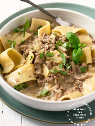 hamburger helper beef stroganoff homemade in a white bowl with large egg noodles