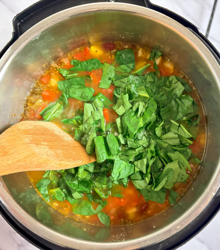 spinach stirred into instant pot minestrone soup