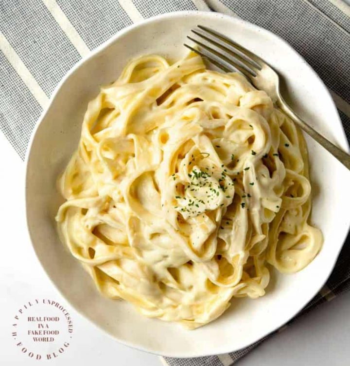 HOMEMADE ALFREDO SAUCE - only 4 ingredients are needed to make this classic Italian rich creamy sauce #alfredo #sauce #happilyunprocessed