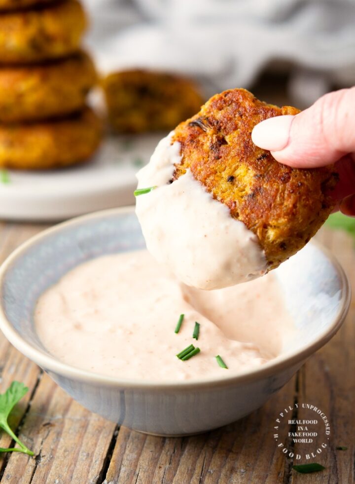 Roasted cauliflower fritters with a Bloomin Onion dipping sauce - roasting the cauliflower takes the water out as well as brings out that caramelized roasted flavor in these fritters #cauliflower #appetizer #vegetarian #happilyunprocessed