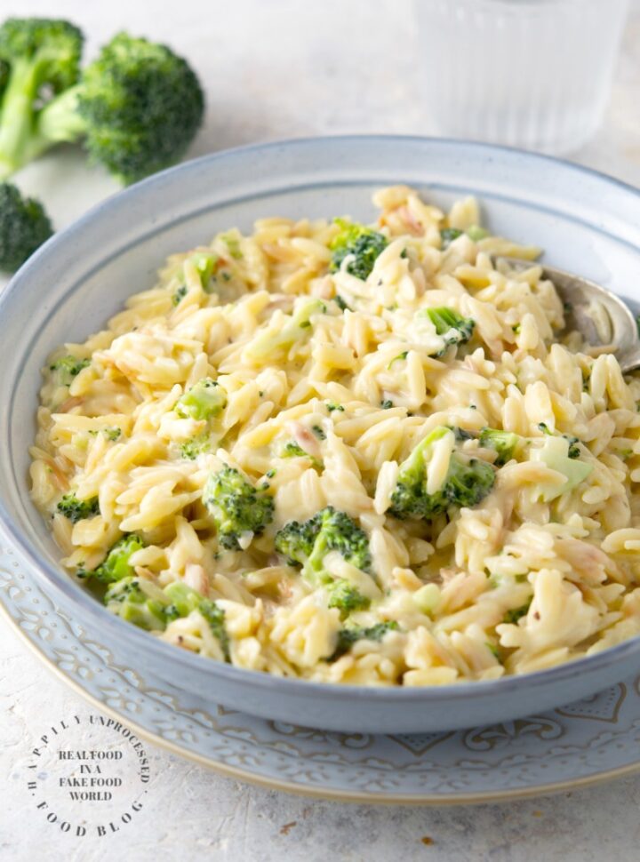 Creamy Cheddar & Broccoli Orzo - little orzo pasta is cooked in broth and married with a creamy cheesy sauce with little bits of broccoli #orzo #sidedish #healthy #happilyunprocessed.com