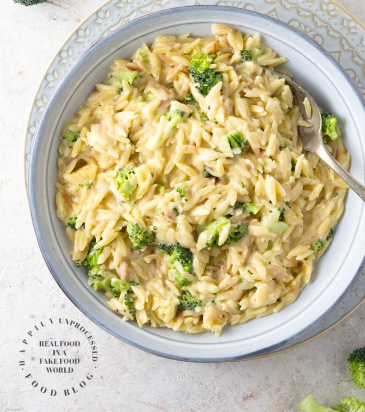 Creamy Cheddar & Broccoli Orzo - little orzo pasta is cooked in broth and married with a creamy cheesy sauce with little bits of broccoli #orzo #sidedish #healthy #happilyunprocessed.com