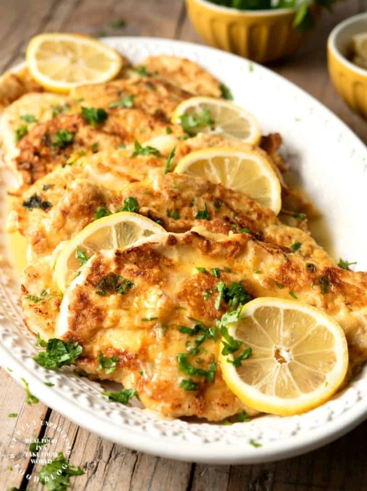 CHICKEN FRANCESE - thinly sliced chicken breasts are floured and egg dipped before sauteeing and simmering in a butter, lemon and wine sauce #chicken #francese #weeknightdinner #happilyunprocessed