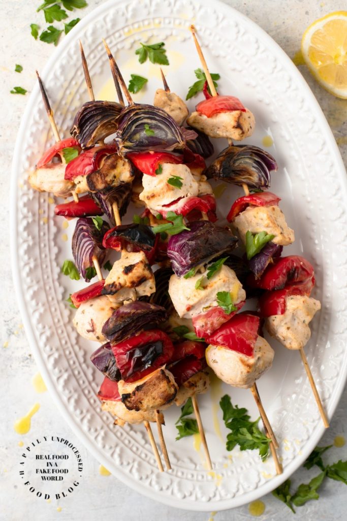 GREEK CHICKEN KEBABS - Yogurt based marinade is the base of the flavors in these delicious chicken kebabs #greek #souvlaki #kebabs #grilling #healthydinner #happilyunprocessed