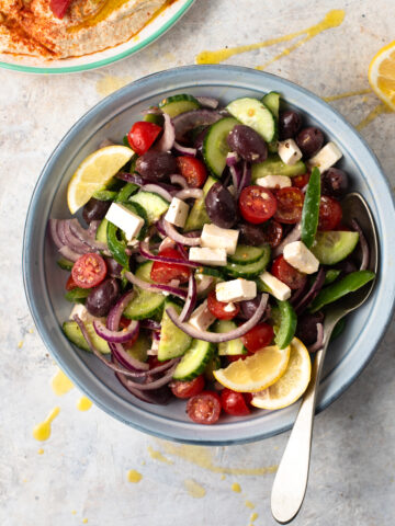 HEALTHY GREEK SALAD with Kalamata olives, cucumber, red onion, feta cheese and tomatoes #greek #greeksalad #healthy #sidedish #lunch #happilyunprocessed