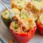 STUFFED PEPPERS WITH GROUND TURKEY AND CAULIFLOWER RICE - cutting back on red meat? These stuffed peppers are so delicious you may need to make more and freeze it #turkey #stuffedpeppers #weeknightdinner #happilyunprocessed.com