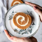 a slice of pumpkin roll on a plate