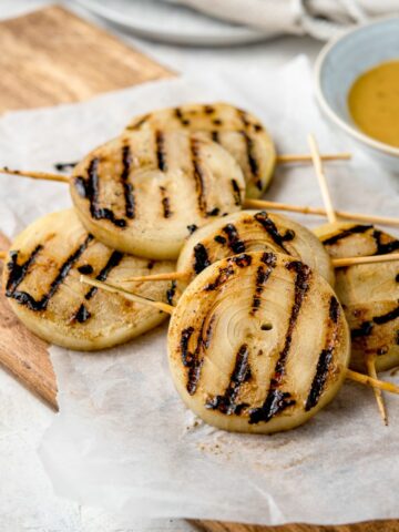 GRILLED ONIONS WITH HONEY MUSTARD GLAZE - Grilled sweet Vidalia onions in a tangy honey mustard glaze straight off the grill #onions #grilling #bbq #summer #happilyunprocessed