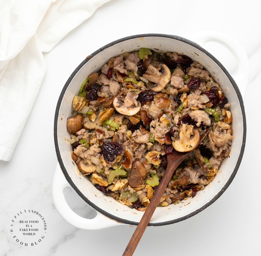 Slow cooker stuffing with sausage, herbs, cranberries and pecans - why wait for Thanksgiving? No turkey needed for this stuffing. Done in a few hours in the slow cooker! #stuffing #thanksgiving sides #sidedish #sausagestuffing