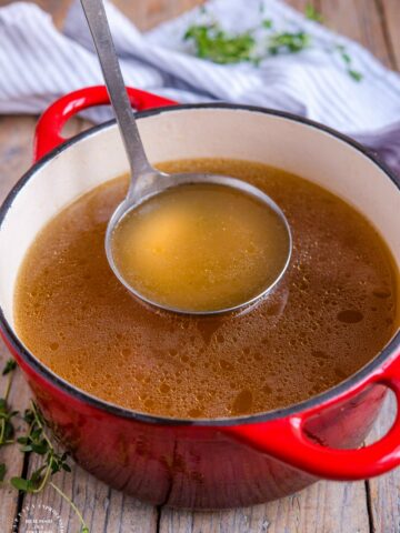Crockpot Turkey Stock - don't throw away those leftovers. Bone broth is one of the healthiest stocks you can make #stock #bonebroth #turkey #thanksgiving