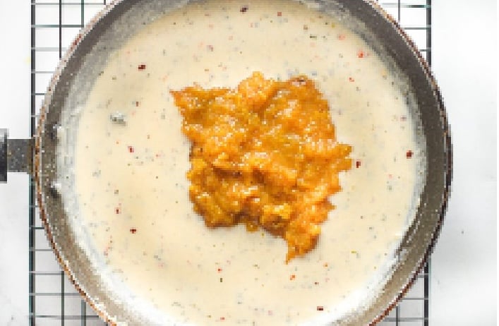 pan with cream and pumpkin puree sauce