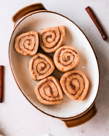 Edit sliced and rolled gingerbread cinnamon rolls in a pan