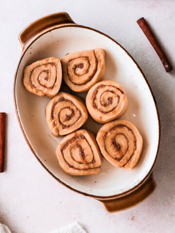 Edit sliced and rolled gingerbread cinnamon rolls in a pan