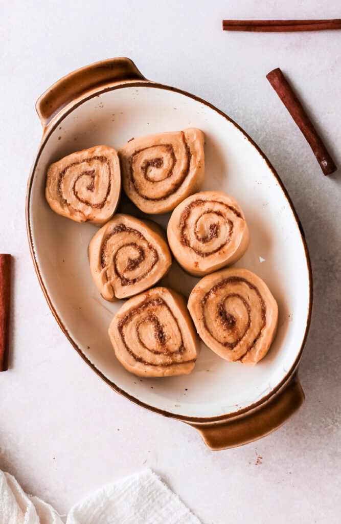 sliced and rolled gingerbread cinnamon rolls in a pan 667x1024 - Gingerbread Cinnamon Rolls