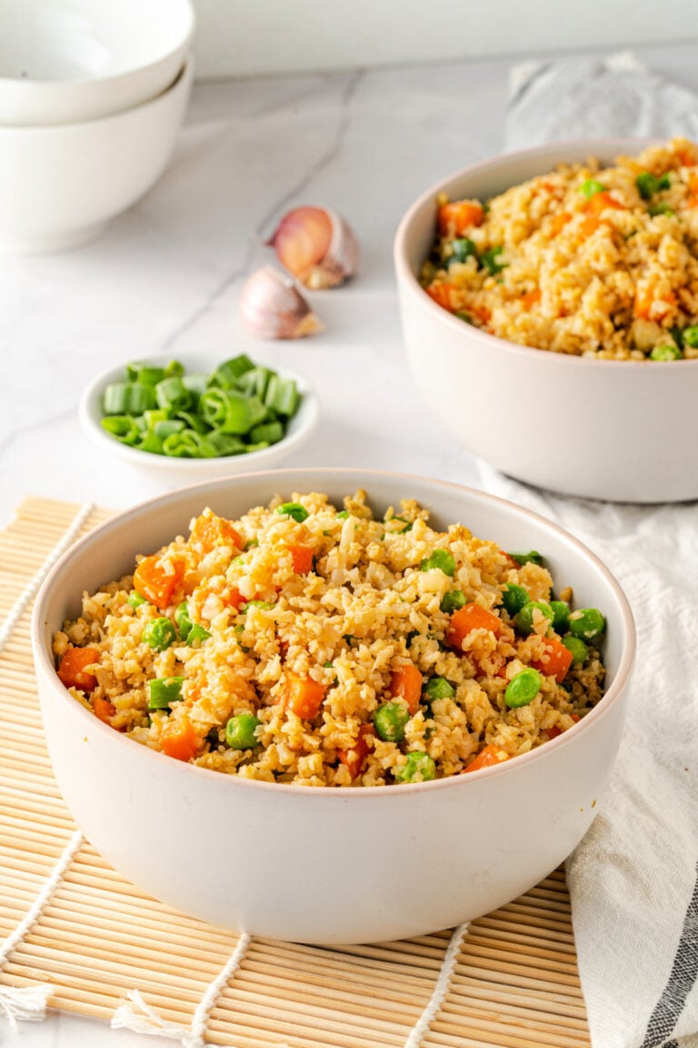 Cauliflower rice in a white bowl is a healthy alternative to chinese rice