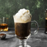 irish coffee with jameson whiskey and whipped cream on top