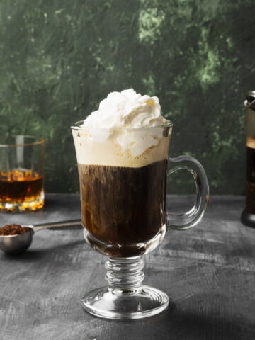irish coffee with jameson whiskey and whipped cream on top