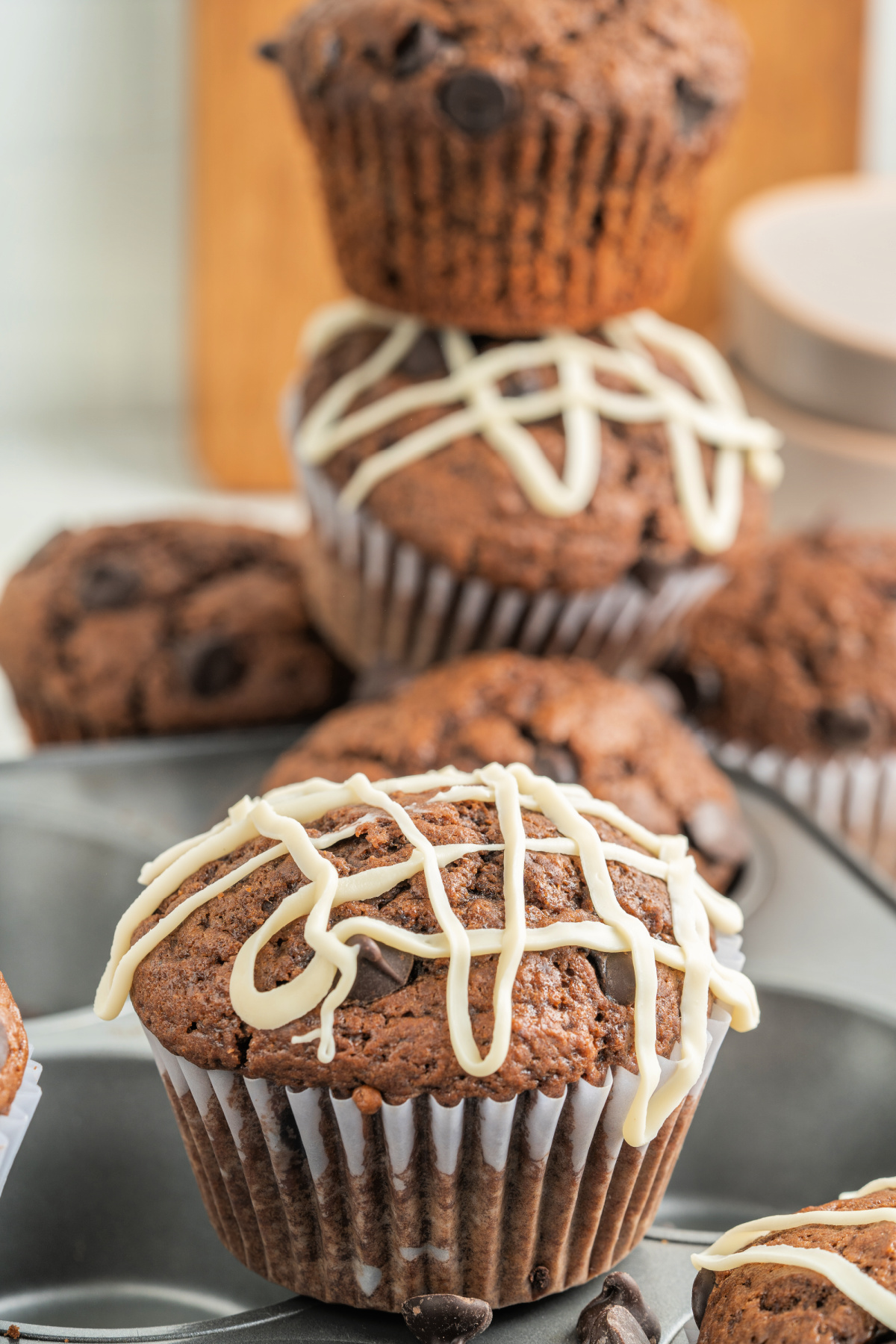 Double chocolate chip muffins with chocolate drizzle on top