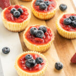 Delicious mini cheesecakes with a graham cracker crust and blueberries on top