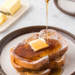 CINNAMON FRENCH TOAST WITH BUTTER AND MAPLE SYRUP