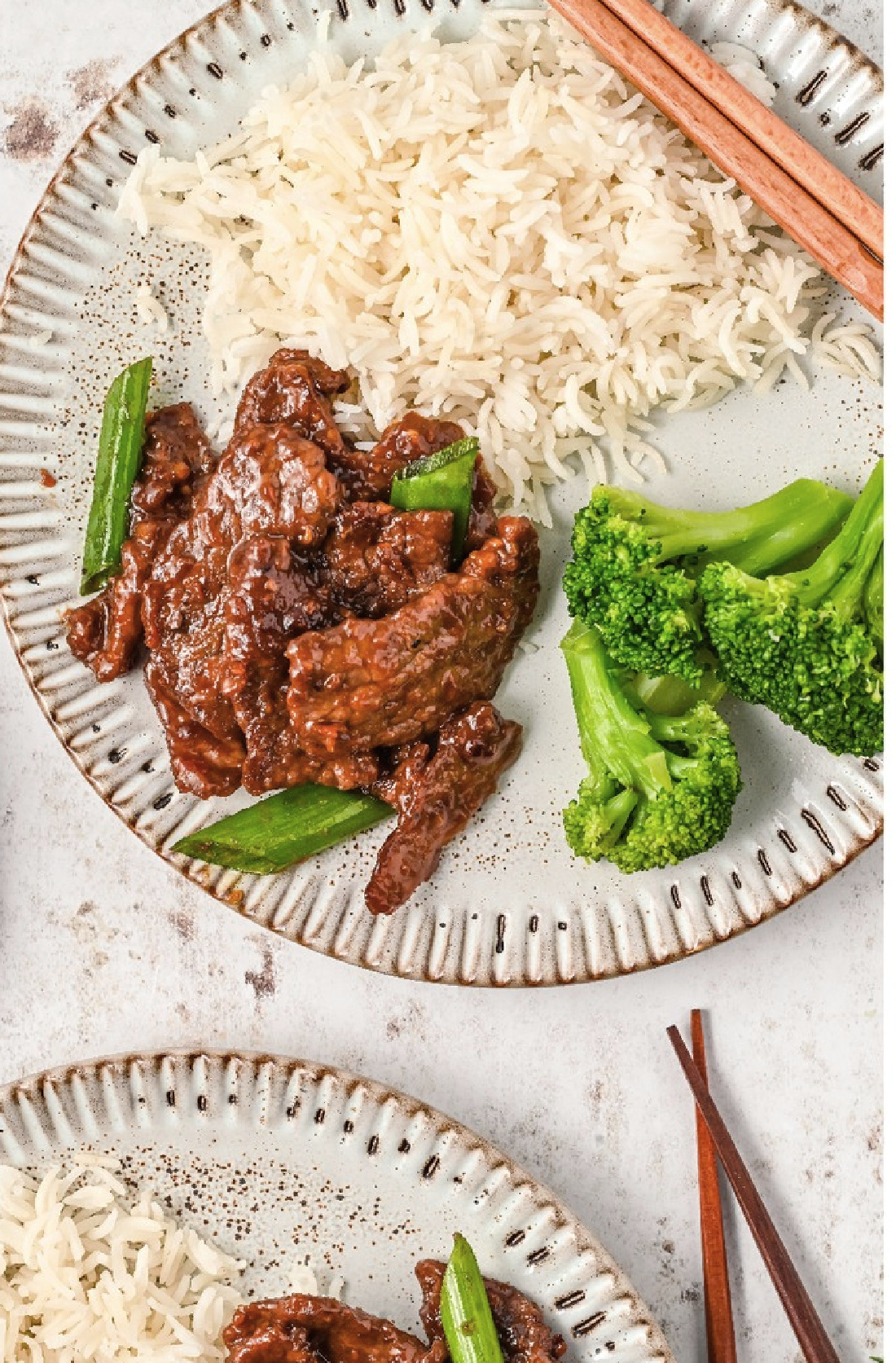 A delicious serving on Mongolian beef with steamed rice and broccoli