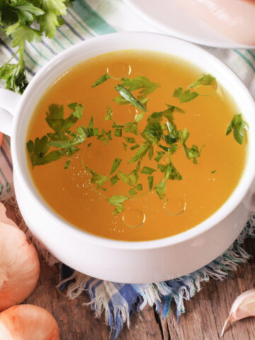 homemade chicken broth in a bowl is full of collagen