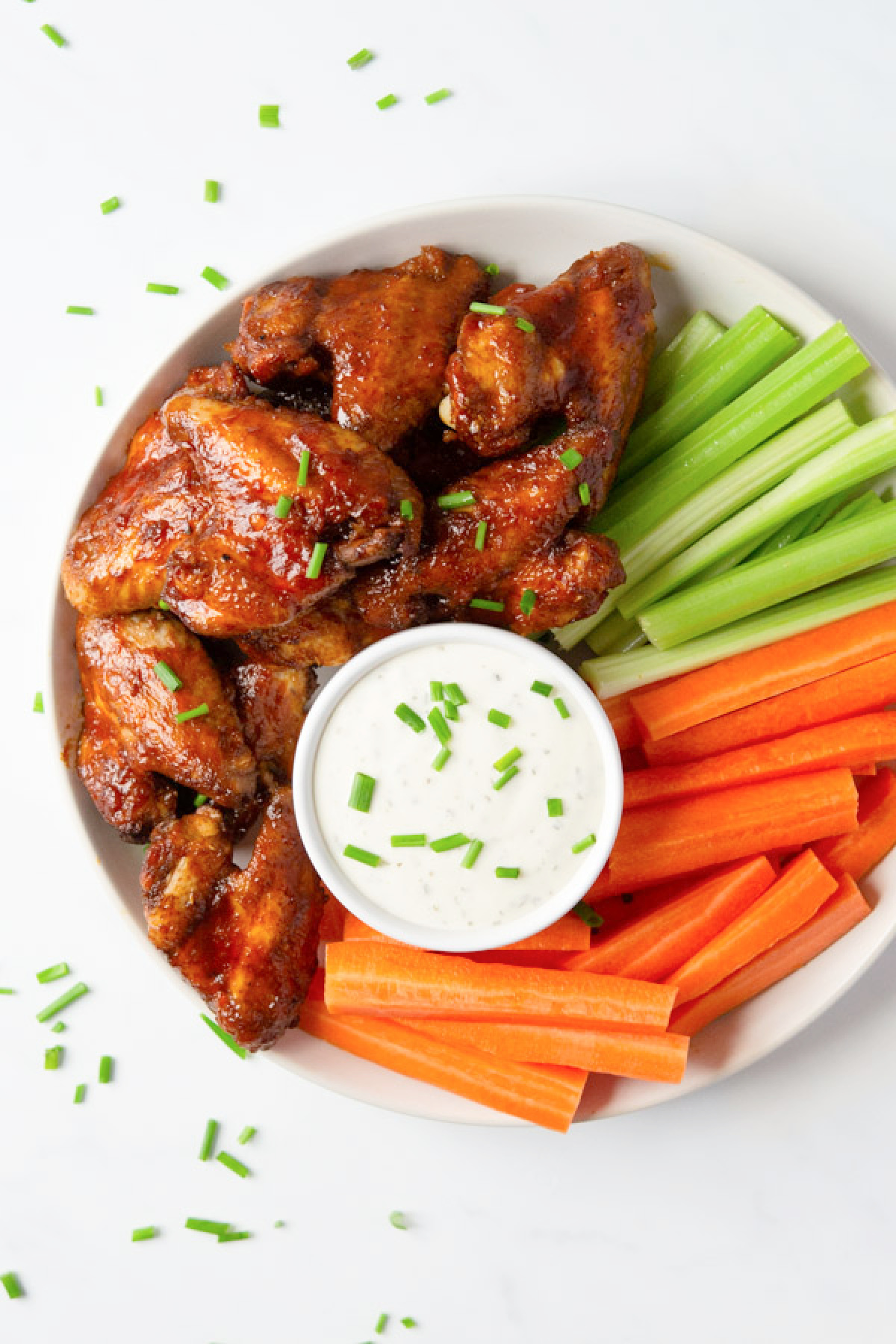 Honey Buffalo Chicken wings with celery and carrots