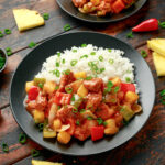 Sweet and Sour Chicken on a plate with rice
