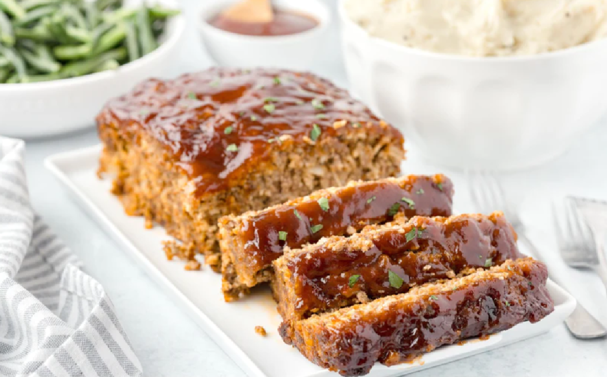 An ultimate meatloaf that is moist and tender topped with a homemade BBQ sauce