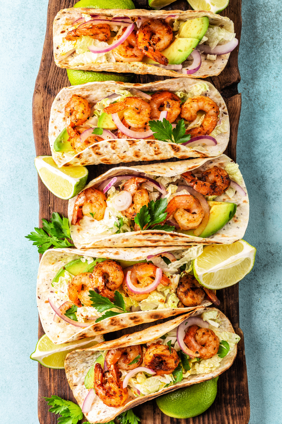 Tequila Lime Shrimp Tacos with cilantro lime slaw and a lime mango salsa