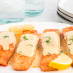 Salmon fillets topped with a creamy dill sauce