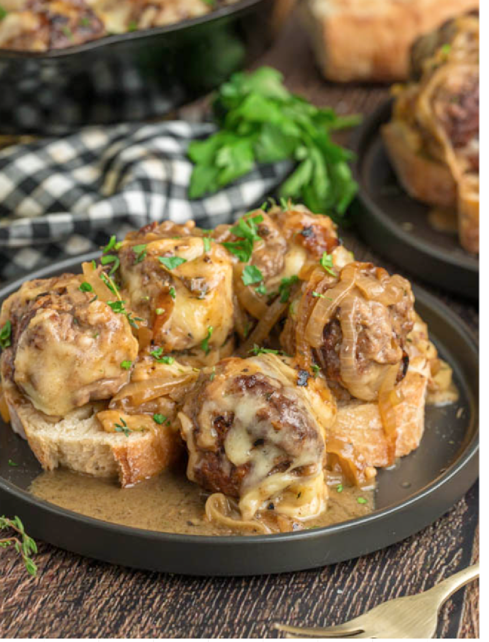 Baked French Onion meatballs on a toasty piece of bread