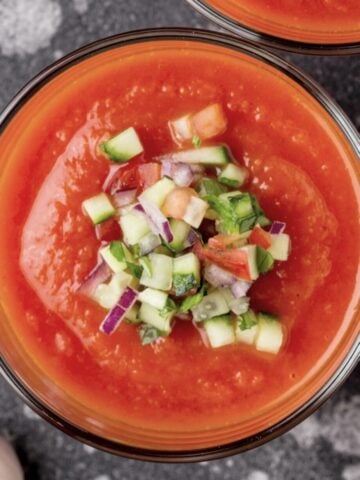 Easy gazpacho recipe with vegetable garnish on top